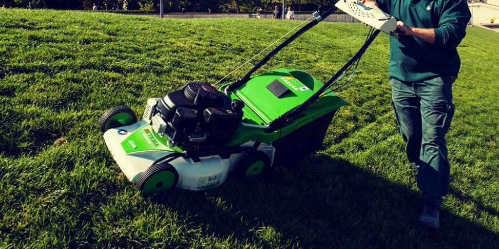 How do I clean an electric mower?